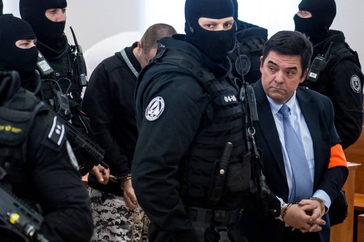 (FILES) Slovak businessman Marian Kocner, suspected of ordering the 2018 assassination of investigative journalist Jan Kuciak and his fiancee Martina Kusnirova (R) and defendant Miroslav Marcek (3rdR) are escorted into the courtroom for the start of their trial at the Judicial Academy building in Pezinok, Slovakia, on December 19, 2019. The alleged mastermind of a Slovak investigative journalist's murder is due to stand another retrial on Monday, eight years after the crime rocked the central European country. — AFP