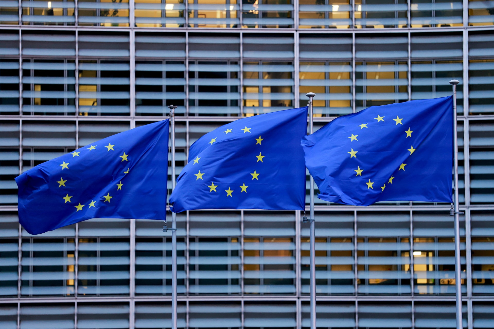 European Union flags flutter outside the European Commission headquarters in Brussels