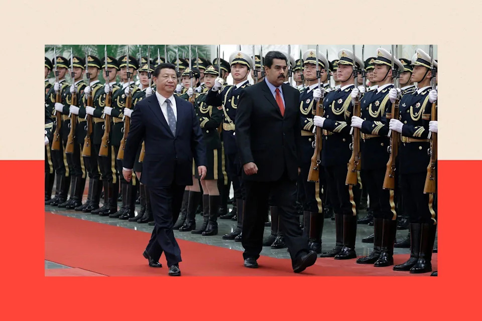 Nicolas Maduro (R) walks with Chinese President Xi Jinping (L) in Beijing, China
