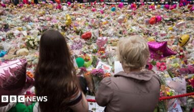 People look at flowers in St Ann's Square in Manchester on 29 May 2017.