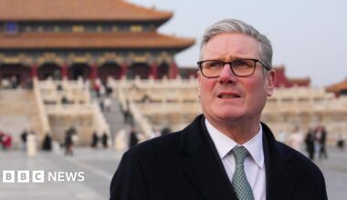 Prime Minister Sir Keir Starmer during a tour of the Forbidden City in Beijing. He is standing in front on a traditional Chinese building and looking into the distance.