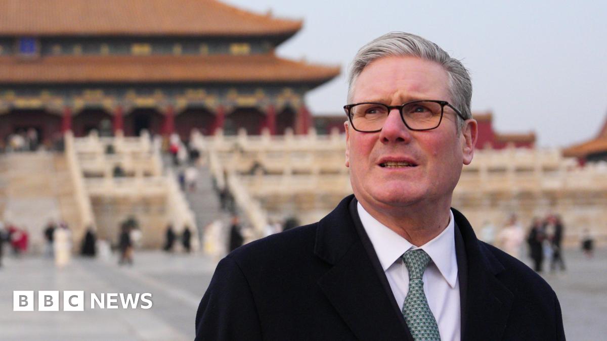 Prime Minister Sir Keir Starmer during a tour of the Forbidden City in Beijing. He is standing in front on a traditional Chinese building and looking into the distance.