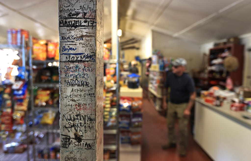 Decades of signatures from visitors to Lake Pillsbury cover support...