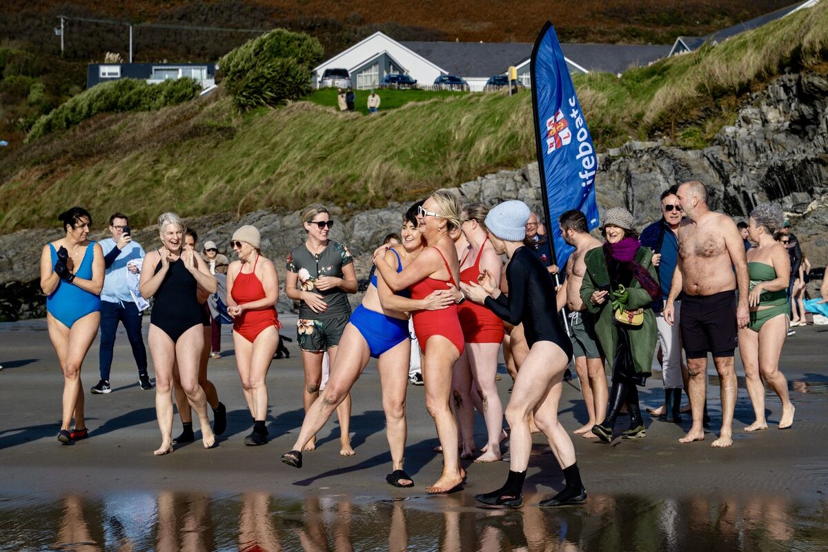Orla Leahy and Biddy Hughes share an emotional embrace on Inchydoney beach. Picture: Chani Anderson