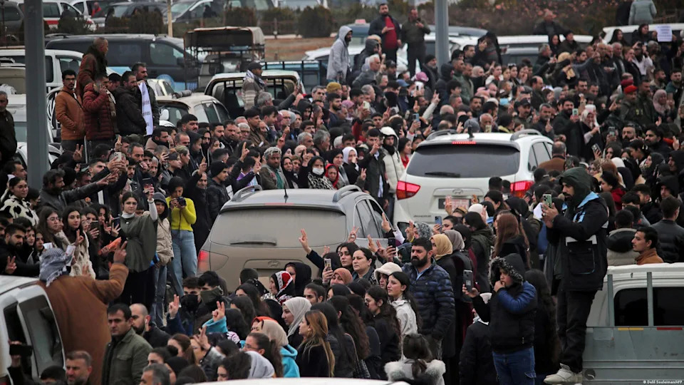 In northeastern Syria, citizens welcome the Kurdish troops who evacuated after Syrian government forces took over parts of Aleppo they previously held<span class="copyright">Delil Souleiman/AFP</span>