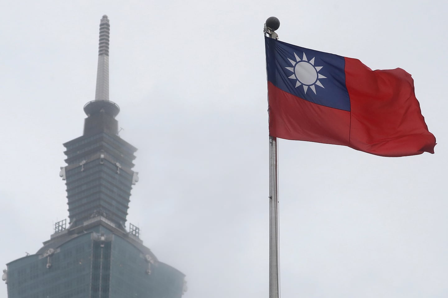 A Taiwan national flag flutters near the Taipei 101 building at the National Dr. Sun Yat-Sen Memorial Hall in Taipei, Taiwan, May 7, 2023.