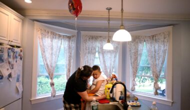 Christina Toledo, 38, (left) comforted her son, Jhon, 4, after he refused to blow out the candles on his birthday cake with his twin brother in Milford on June 11.