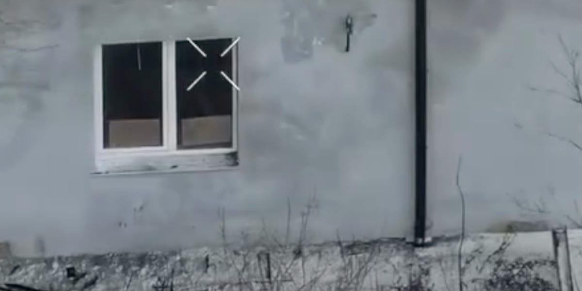 A Russian soldier surrendered by writing 'Please take me prisoner, I want to live' on cardboard seen by a drone, units say