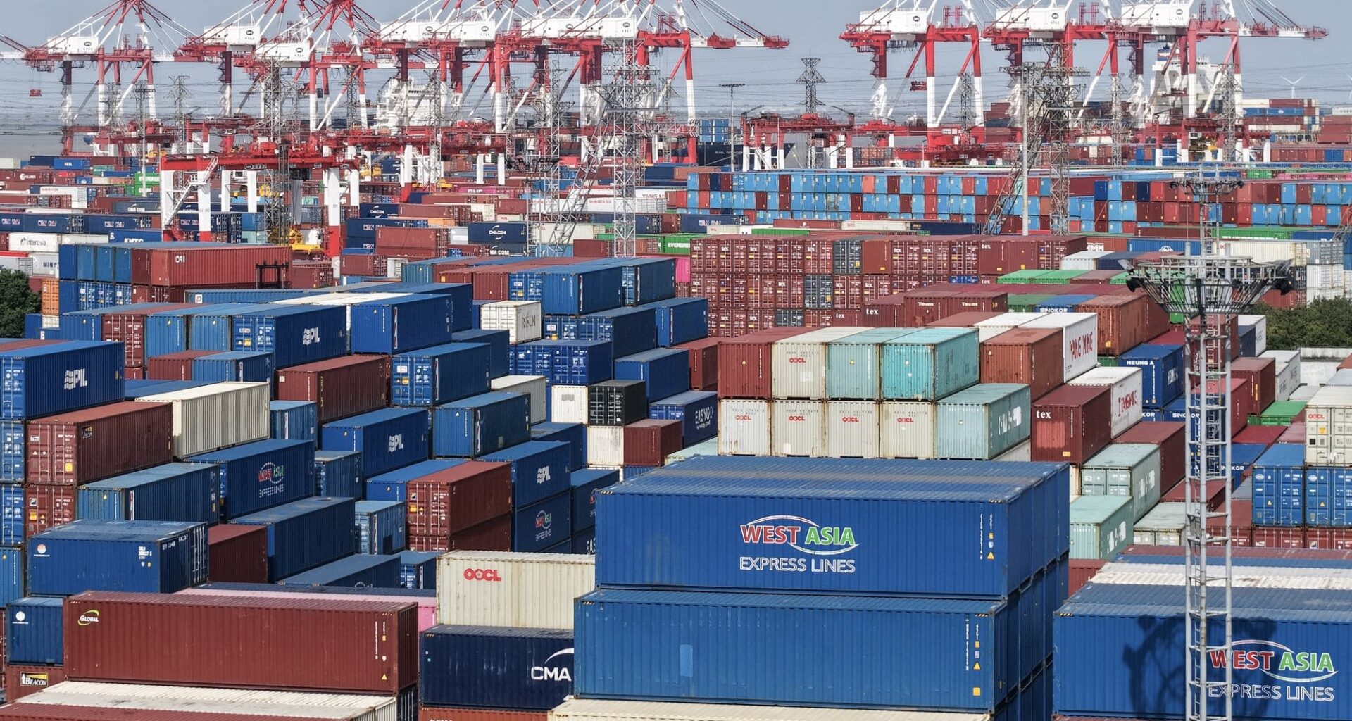Shipping containers await ships at the Shanghai Port container terminal.