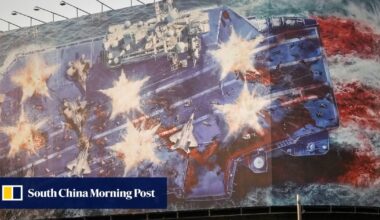 Iran unveils bloody anti-US billboard as carrier force nears