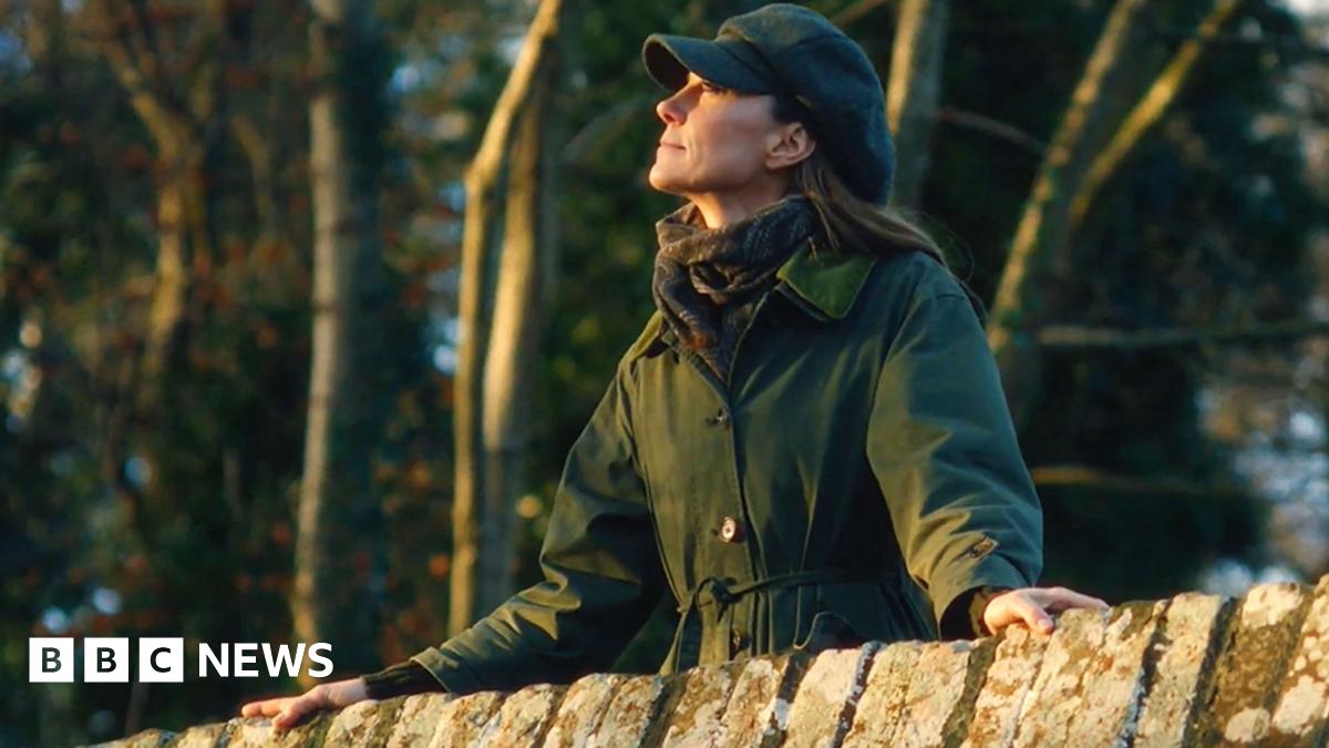Princess of Wales on a bridge in a coat on a walk in the countryside