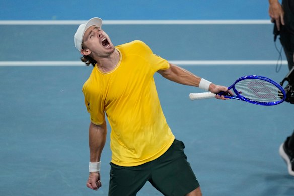 Alex de Minaur roars after securing victory against Hubert Hurkacz.