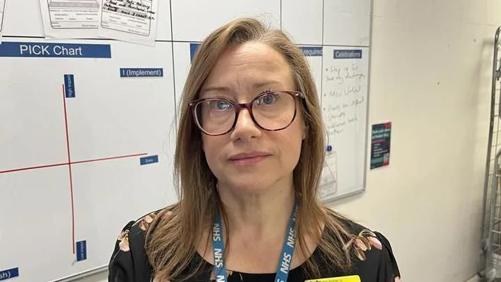 Tracy Stocker, Director of Operations at Medway Maritime Hospital, standing in front of a whiteboard in the virtual ward office