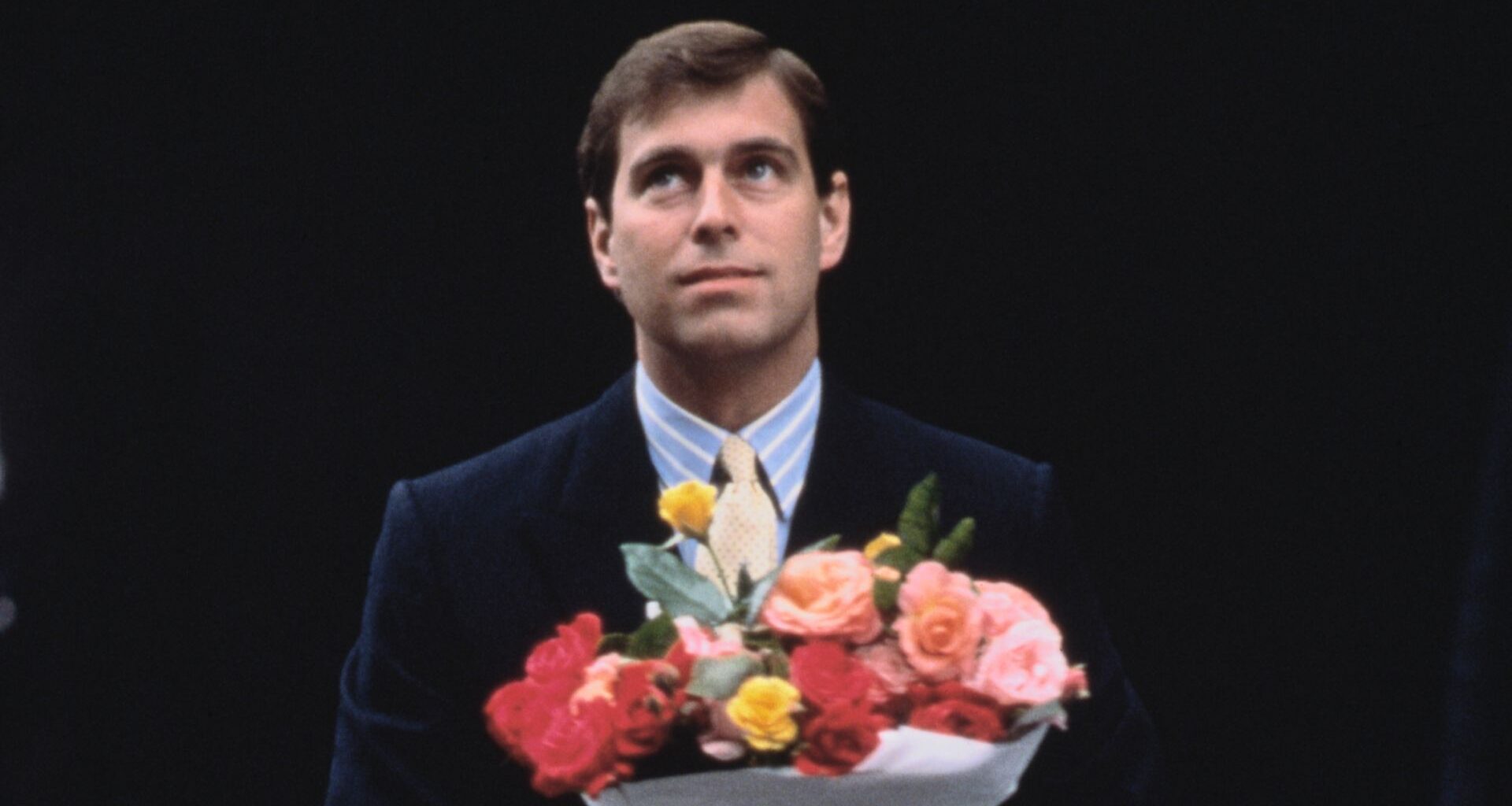 Prince Andrew arrives with flowers after the birth of his first daughter, Princess Beatrice, London, 9th August 1988