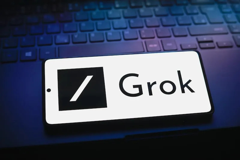 In this photo illustration, the Grok logo is displayed on a smartphone screen, Aug. 5, 2024. | JAQUE DA SILVA