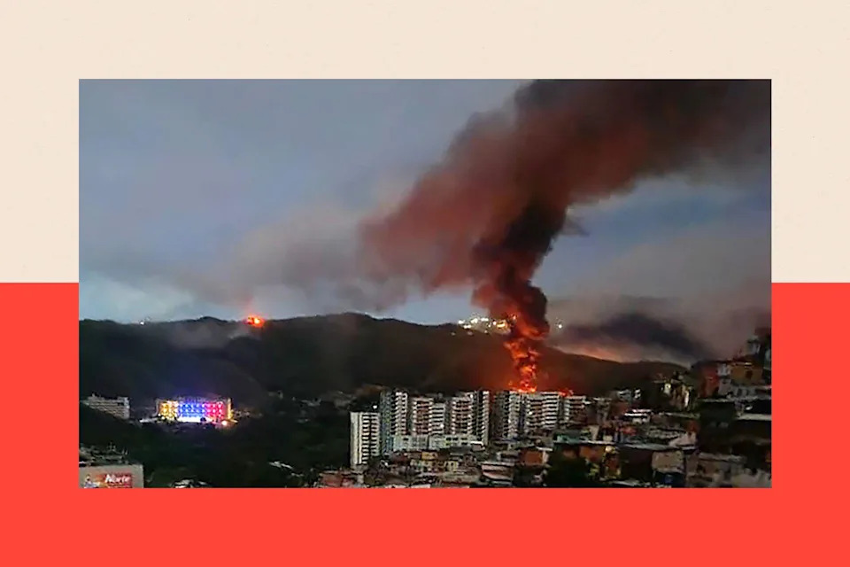 Fire at Fuerte Tiuna, Venezuela's largest military complex, is seen from a distance after a series of explosions in the Venezuelan capital Caracas 