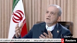 Iranians President Masud Pezeshkian speaks during an interview with state TV amid protests in Tehran.