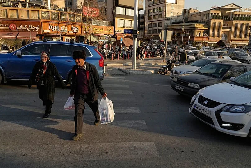 People walk at Tajrish Square in northern Tehran, 27 January, 2026