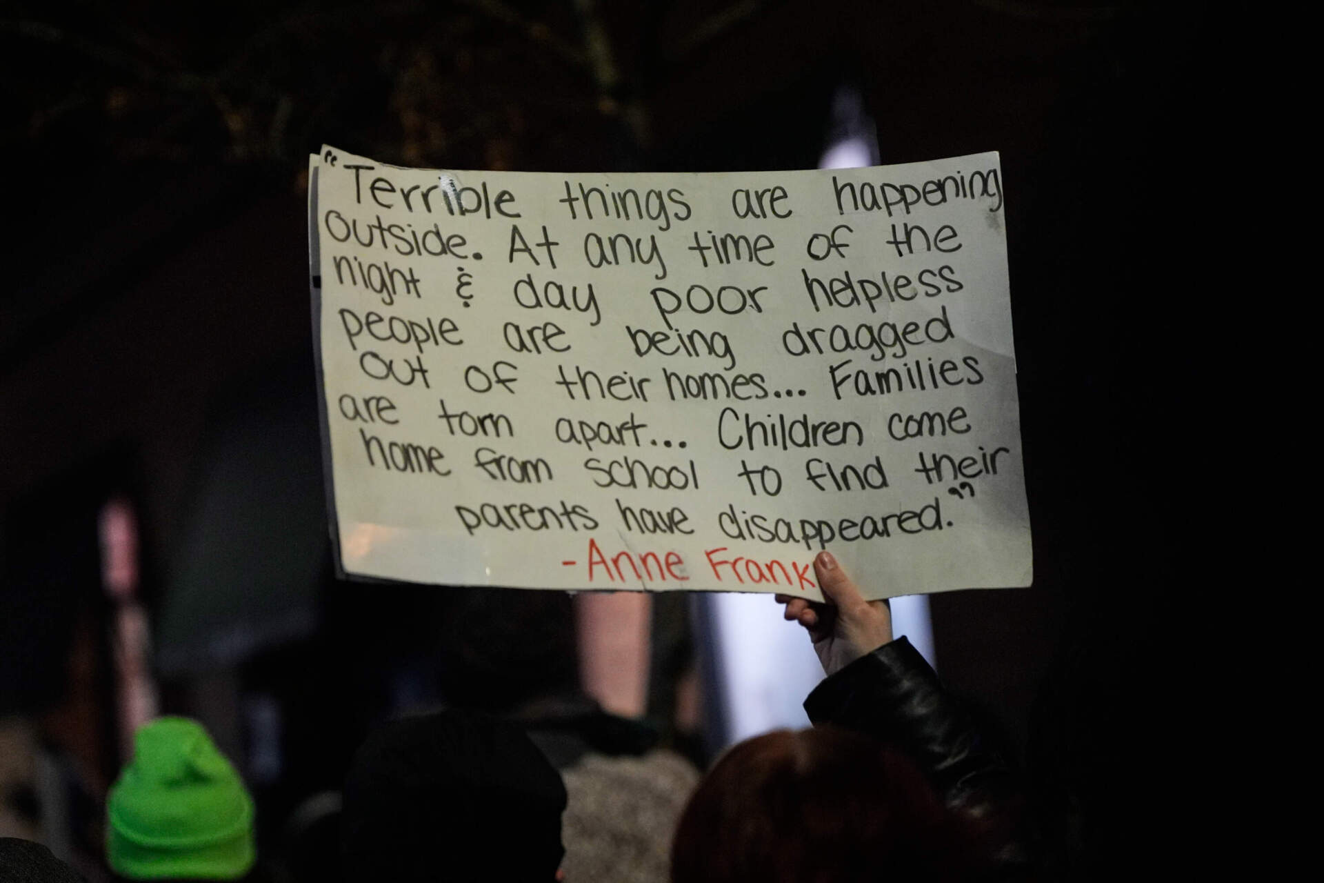 A demonstrator holds up a sign during a protest and noise demonstration calling for an end to federal immigration enforcement operations in the city on Jan. 9 in Minneapolis. (Jen Golbeck/AP)