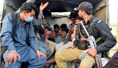 Pakistani police detain Afghan asylum seekers during a raid operation targeting undocumented migrants in Pakistan. (Photo Credit: Guardian)