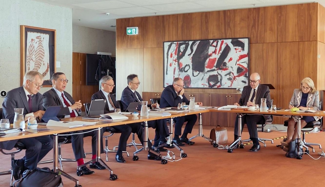 Justice Roberto Ribeiro (second left), giving a presentation in Canberra on March 24, 2025. Chief Justice Cheung (third left) and Justice Johnson Lam (fourth left) were also in attendance. Source: The Government of the Hong Kong Special Administrative Region.