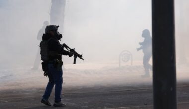 Federal immigration officers deploy tear gas after Border Patrol agents shot and killed Alex Pretti in Minneapolis, on Saturday.