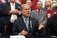 FILE - Texas Gov. Greg Abbott speaks to the media following a bill signing as Texas senators...