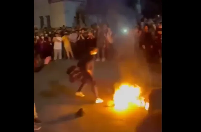 Protesters Set Burqa on Fire