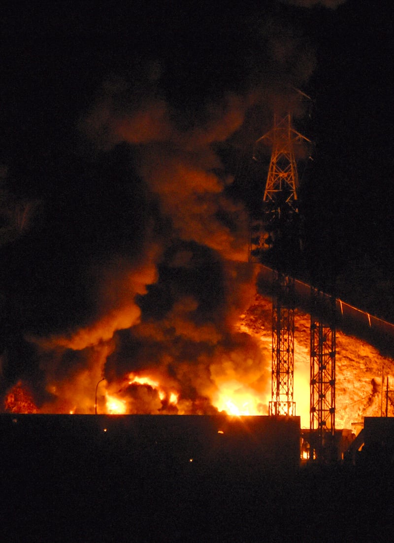 Flames rise at Fuerte Tiuna, Venezuela's largest military complex, after a series of explosions in Caracas on January 3, 2026—Trump announced a “large scale strike” on the country on Truth Social.