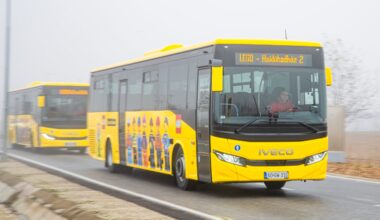 A yellow bus with LEGO people on the side