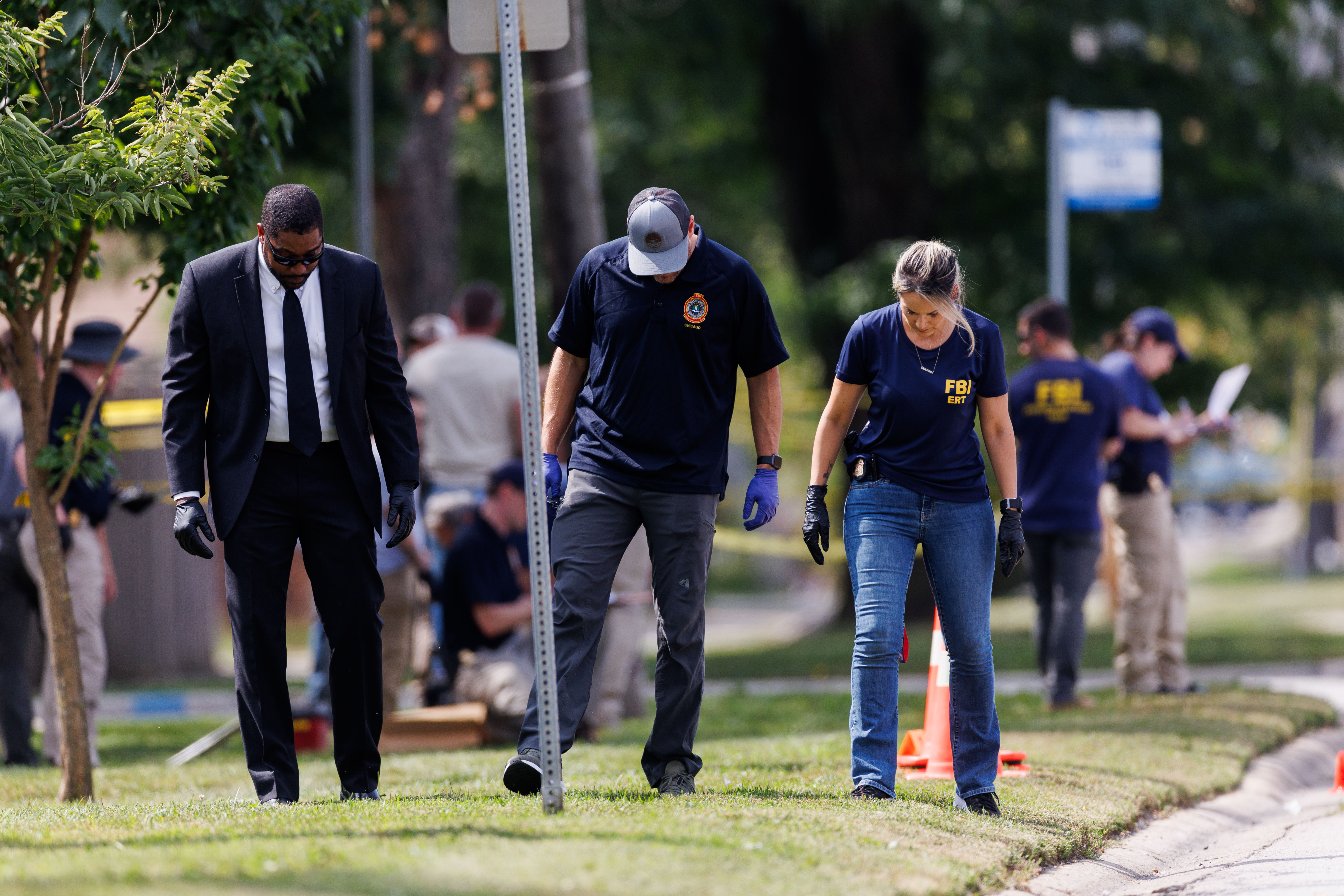 The FBI and other law enforcement officers investigate the scene...