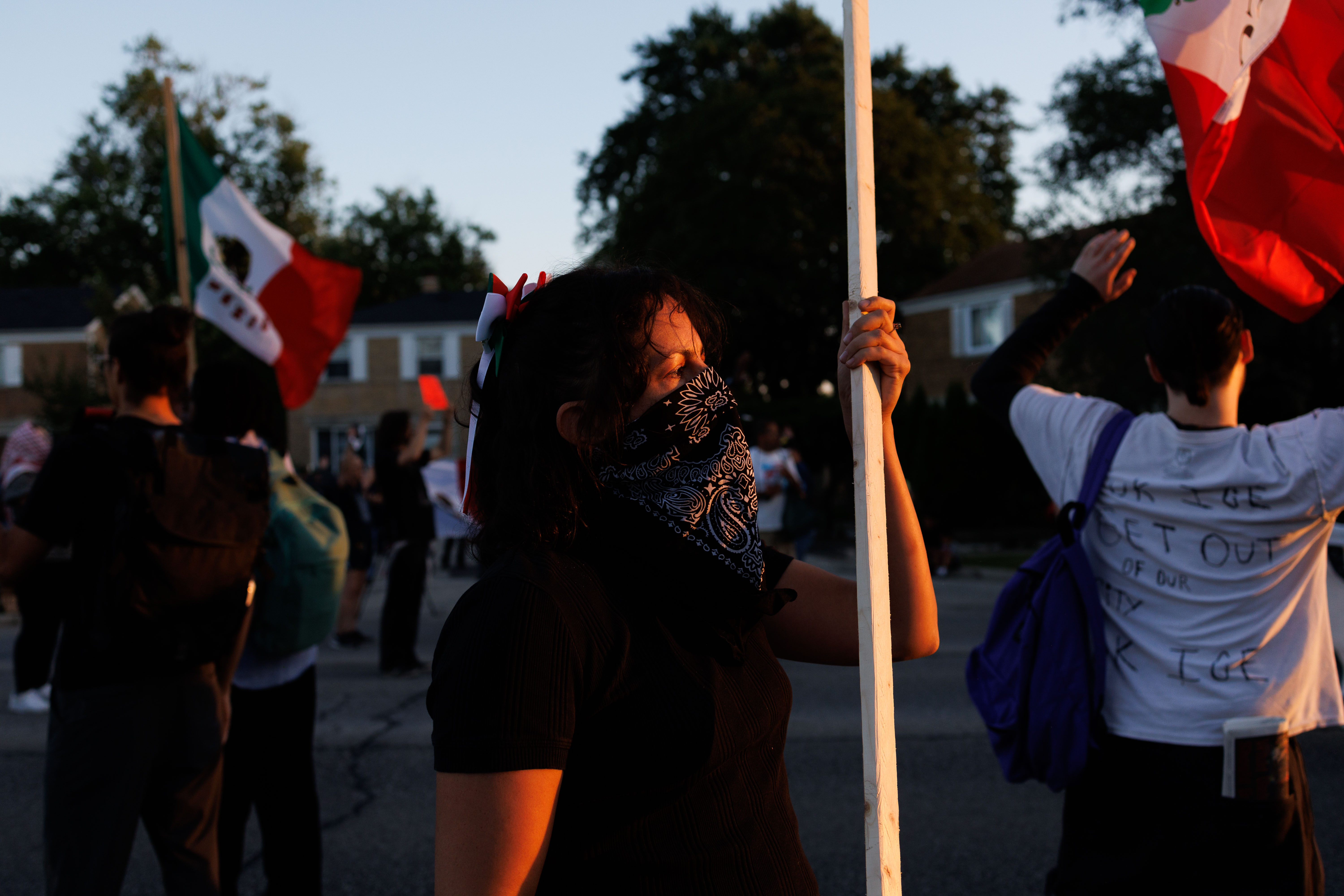 People gather along West Grand Avenue in Franklin Park, Sept....