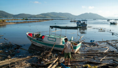 At Xuan Dao Bay, in Vietnam, fishing boats lie destroyed in November 2025 along the shore after being swept away by Typhoon Kalmaegi. leaving many without work. Credit: Magdalena Chodownik/Anadolu via Getty Images