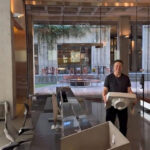 Edited picture of Elon Musk entering the Ryanair office with a porcelain bathroom sink (screenshot from Musk's video entering Twitter headquarters on October 26, 2022). Edited with Grok AI.