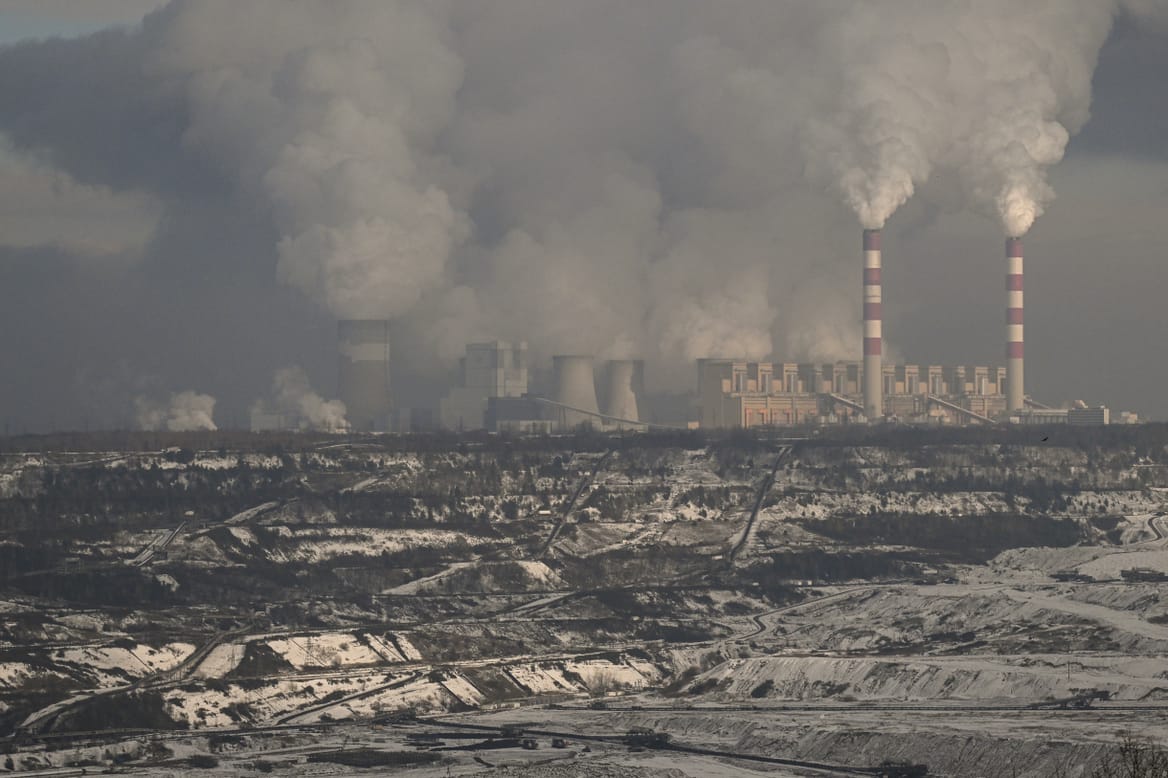 The lignite coal-powered Belchatow Power station as smoke and steam rises from the cooling towers