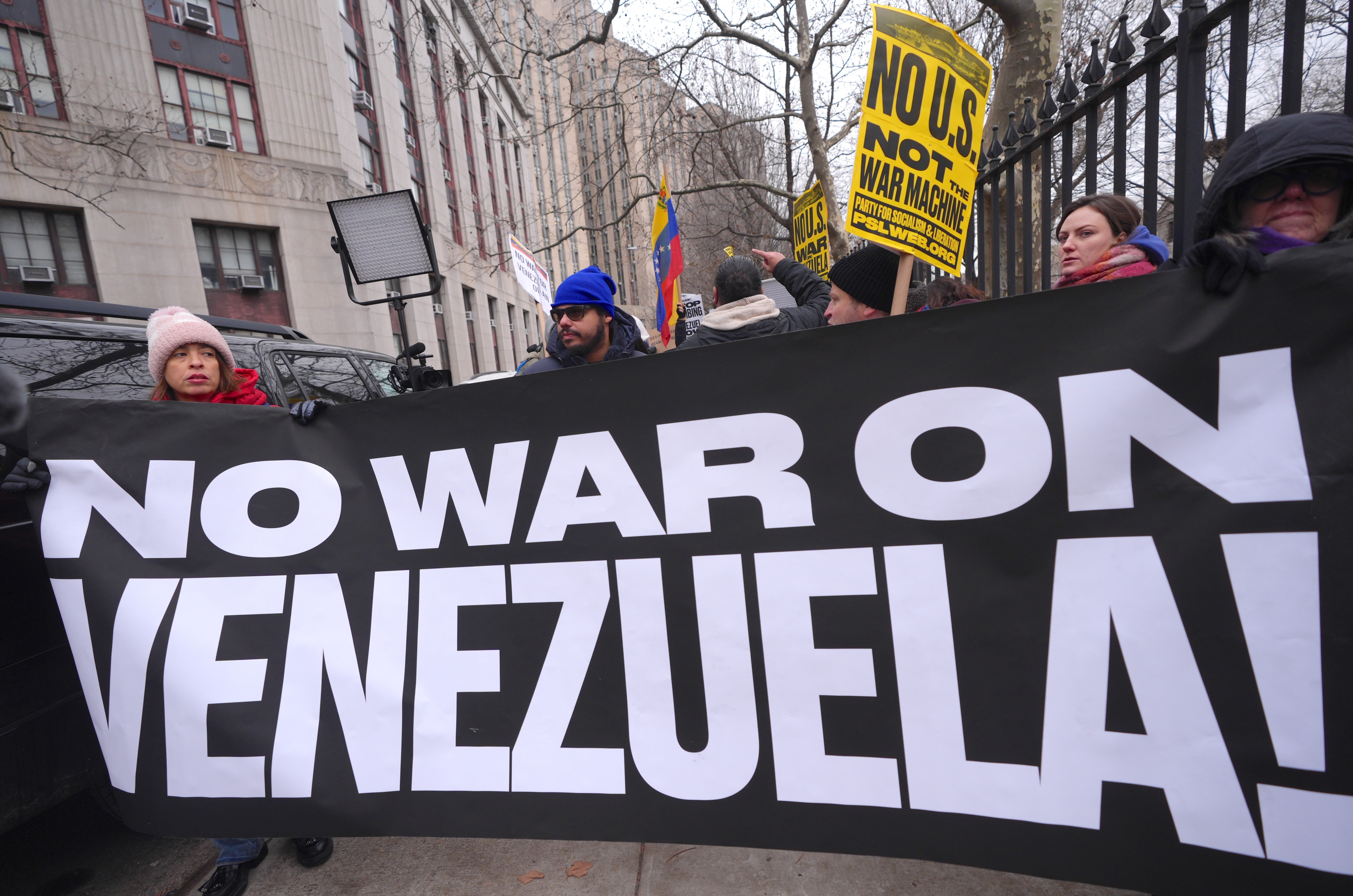 NEW YORK, UNITED STATES - JANUARY 5: Opponents of the United Statesâ military operation and supporters of Venezuelaâs President NicolÃ¡s Maduro gather outside the Manhattan Federal Court in New York, United States as he appears in federal court on drug trafficking and narco-terrorism charges following his capture and transfer to the United States, on January 5, 2026. U.S. authorities arrest Maduro after a military action in Venezuela earlier this month, and he pleads not guilty to the charges in Manhattan. (Photo by Selcuk Acar/Anadolu via Getty Images)