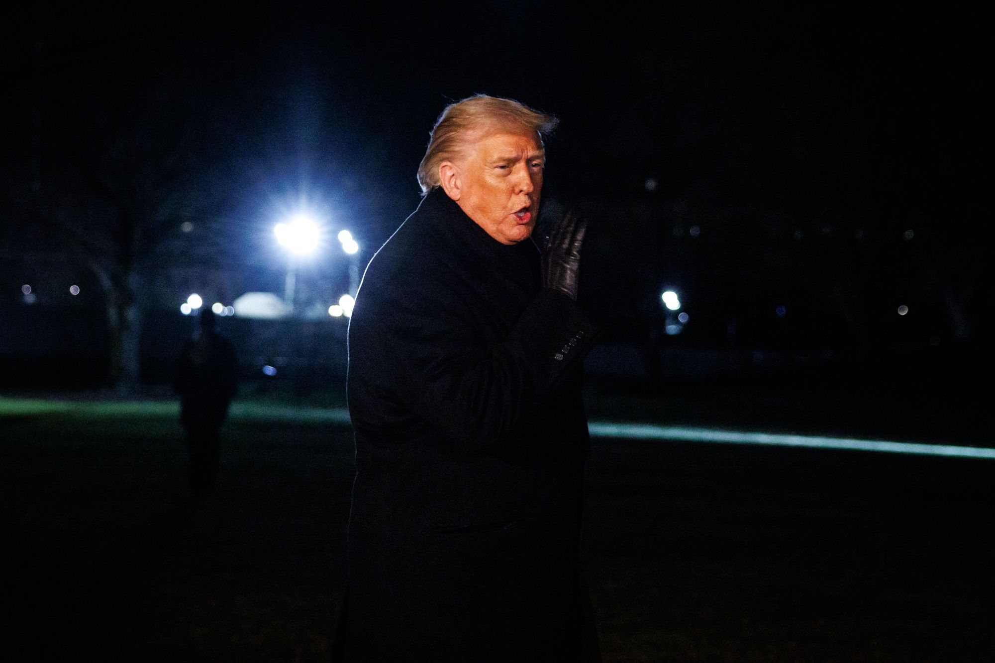 U.S. president Donald Trump makes a brief statement to reporters before departing from the South Lawn of the White House in Marine One on January 20, 2026 in Washington, DC