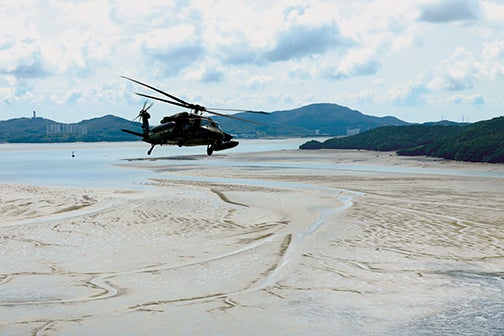 A UH-60 Black Hawk assigned to the 2nd Combat Aviation Brigade, 2nd Infantry Division/Republic of Korea-U.S. Combined Division, flies over the coast of South Korea during an exercise.  (U.S. Army/Staff Sgt. Brea DuBose)