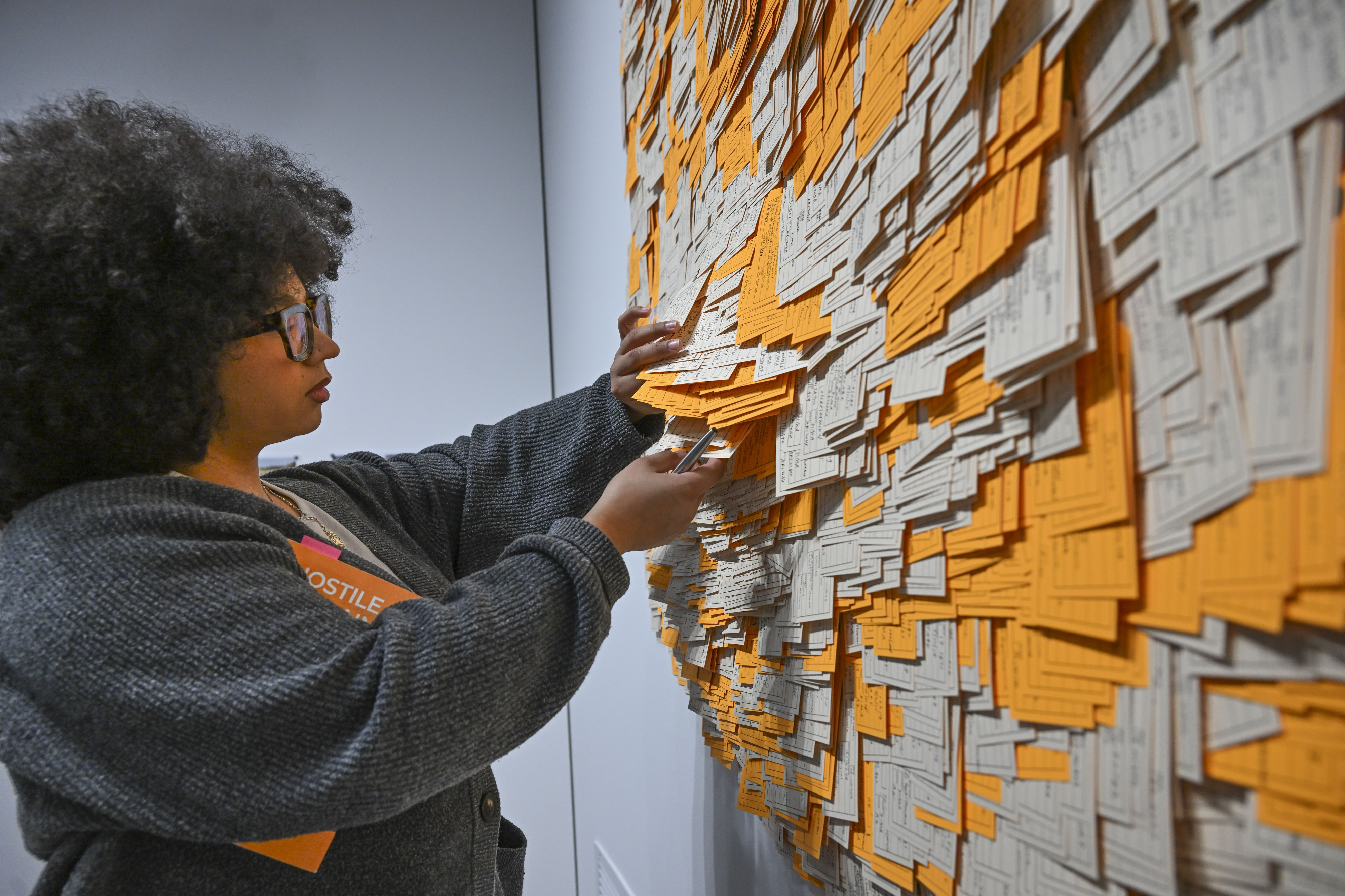 Tatyana Henry, a gallery assistant at the Wignall Museum, looks...
