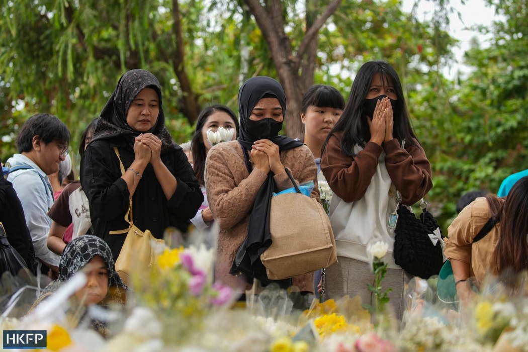 This photo, taken on November 30, 2025, shows people mourning the victims who died in the massive fire at Tai Po Wang Fuk Court, including migrant domestic workers from Indonesia and the Philippines. Photo: Kyle Lam/HKFP.