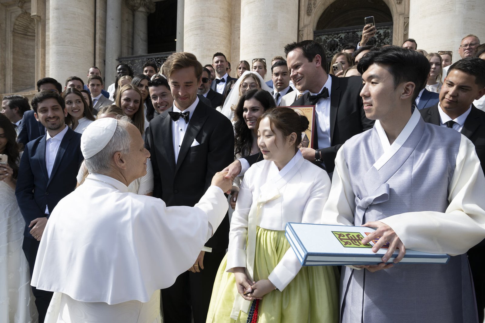 Brandon Barlow shakes hands with Pope Leo XIV after the general audience in St. Peter's Square on Oct. 1, 2025. Brandon and his bride, Gabriella, planned their wedding around going on the Sposi Vovelli pilgrimage for newlyweds, initially planning on meeting Pope Francis, but blessed to greet the American pope.