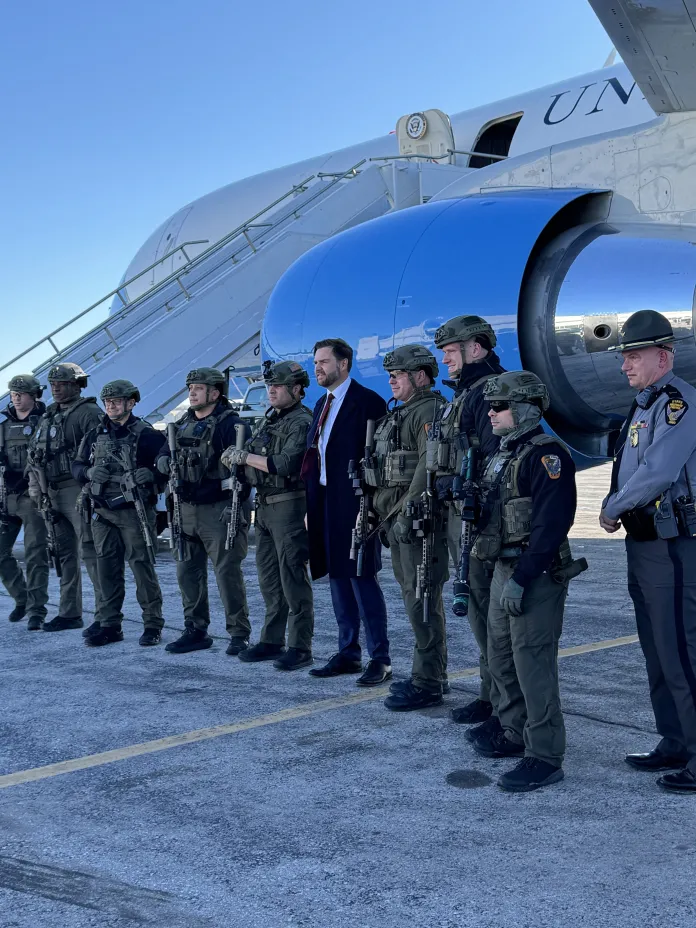 Vice President JD Vance poses with law enforcement officers in Toledo, Ohio (Washington Examiner, Christian Datoc)