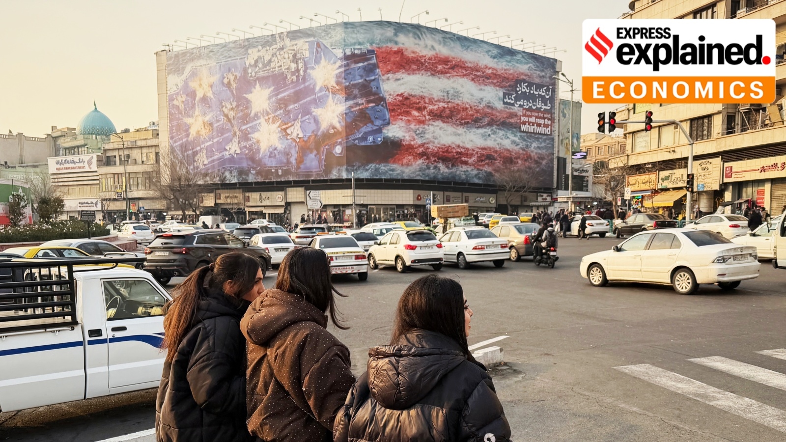 A billboard showing a US aircraft carrier with damaged jets on its deck, and sign reading: "If you sow the wind, you'll reap whirlwind," at the Enqelab-e-Eslami square, in Tehran, Iran, Jan. 25, 2026.
