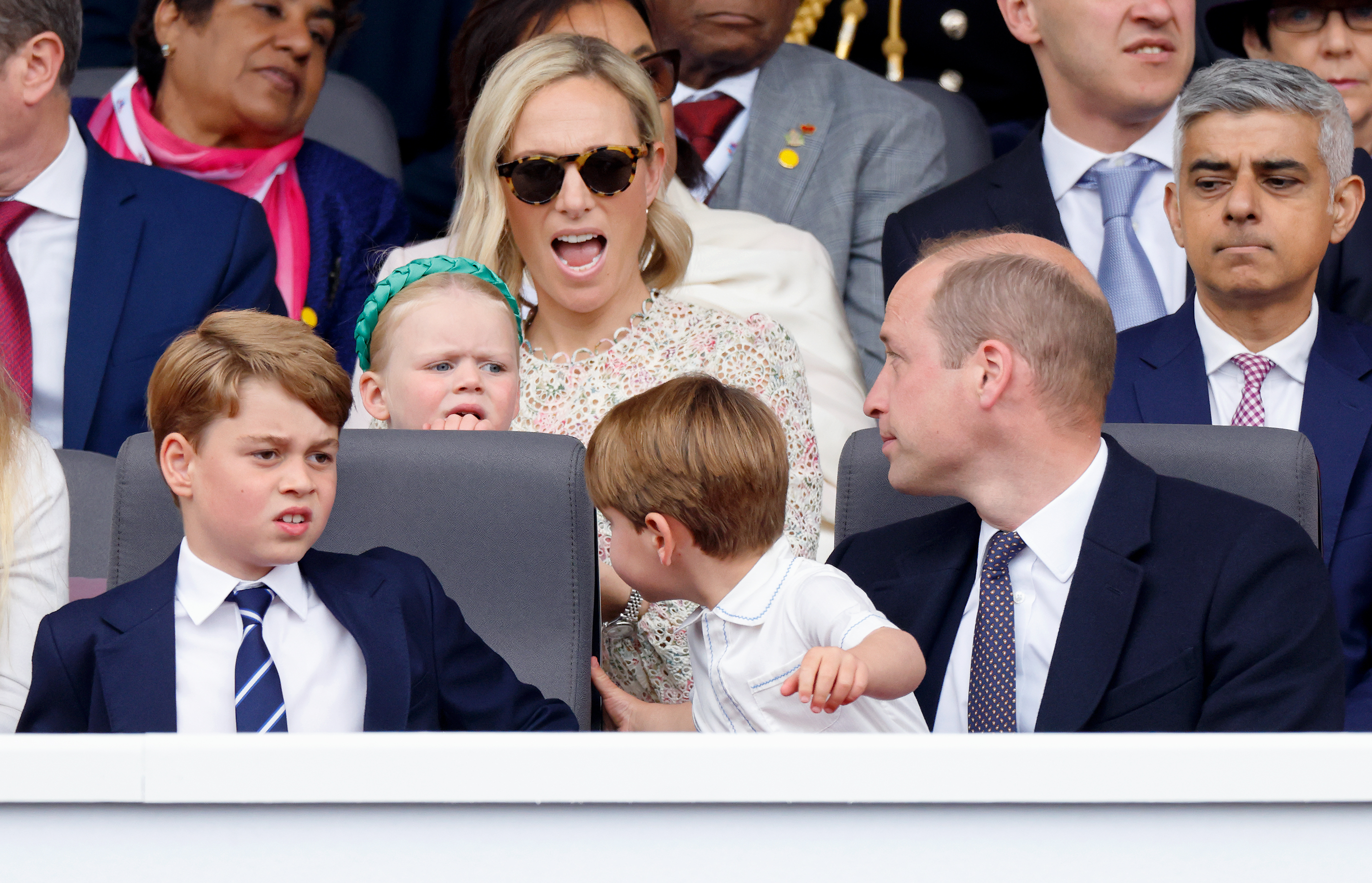 Prince Louis and Lena Tindall appear to have a tense exchange during the Platinum Jubilee Pageant on The Mall on June 5, 2022 in London, England