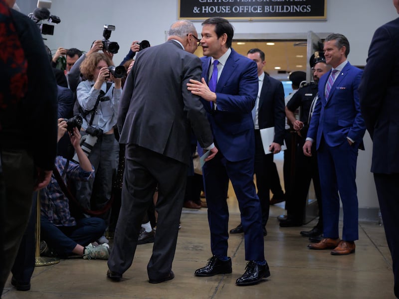 WASHINGTON, DC - JANUARY 07: Senate Minority Leader Charles Schumer (D-NY) (L) talks with U.S. Secretary of State Marco Rubio before he and Secretary of War Pete Hegseth speak to reporters in between closed door briefings about the U.S. capture of Venezuela’s Nicolas Maduro and his wife, Cilia Flores, at the U.S. Capitol on January 7, 2026 in Washington, DC. Maduro and Flores were taken to New York on Saturday after they were captured by the U.S. military in Caracas. They are being detained at the Metropolitan Detention Center in Brooklyn and are expected to face federal charges related to drug trafficking and working with gangs designated as terrorist organizations.  (Photo by Chip Somodevilla/Getty Images)