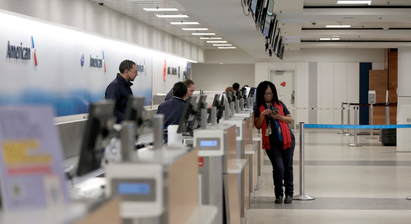 With most flights canceled at Logan because of the storm last Sunday, customer service agents milled around the American Airlines check-in counter. 