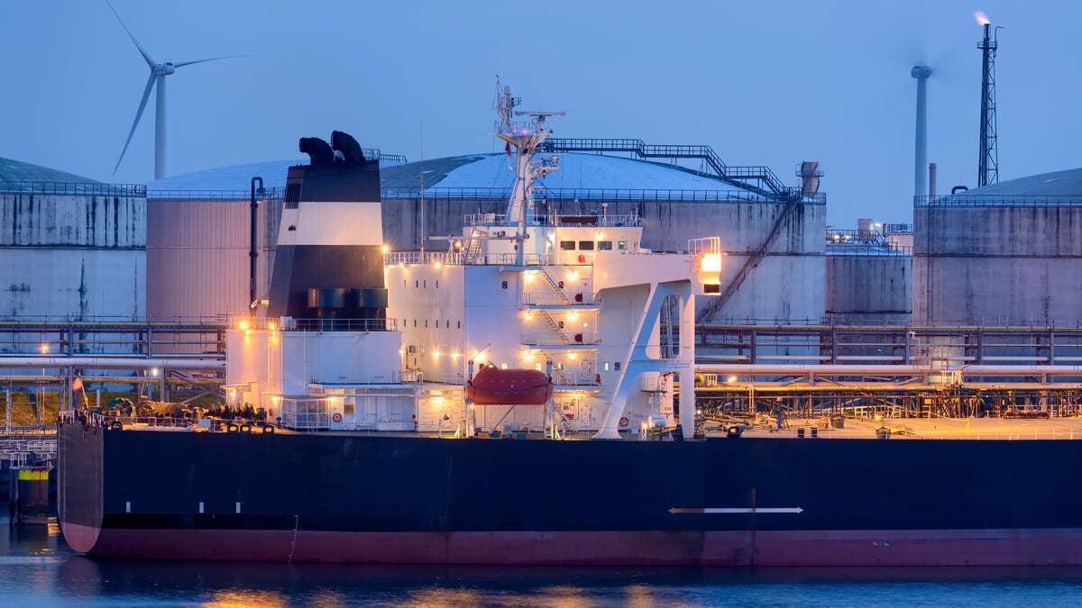 A liquid natural gas (LNG) tanker ship and storage tanks are seen at the Port of Rotterdam in 2019