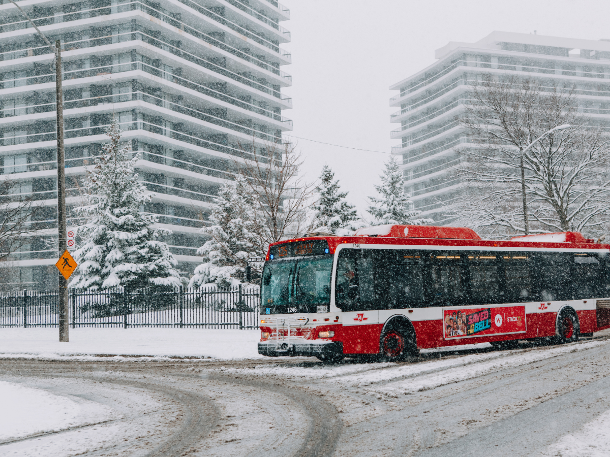 A red bus in Ontario during winter