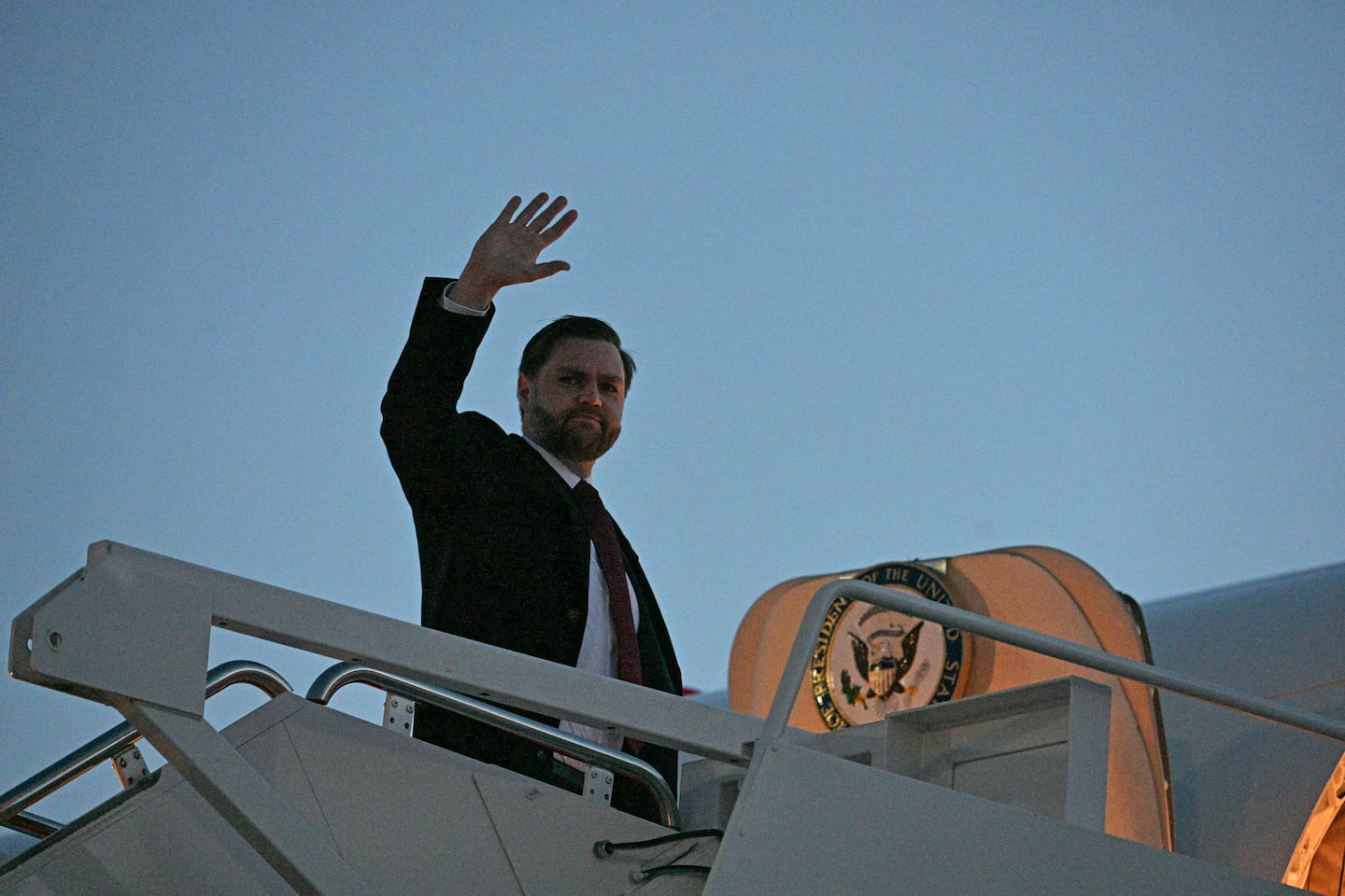 US Vice President JD Vance waves as he boards Air Force two before departing Joint Base Andrews on January 22, 2026 in Maryland. 