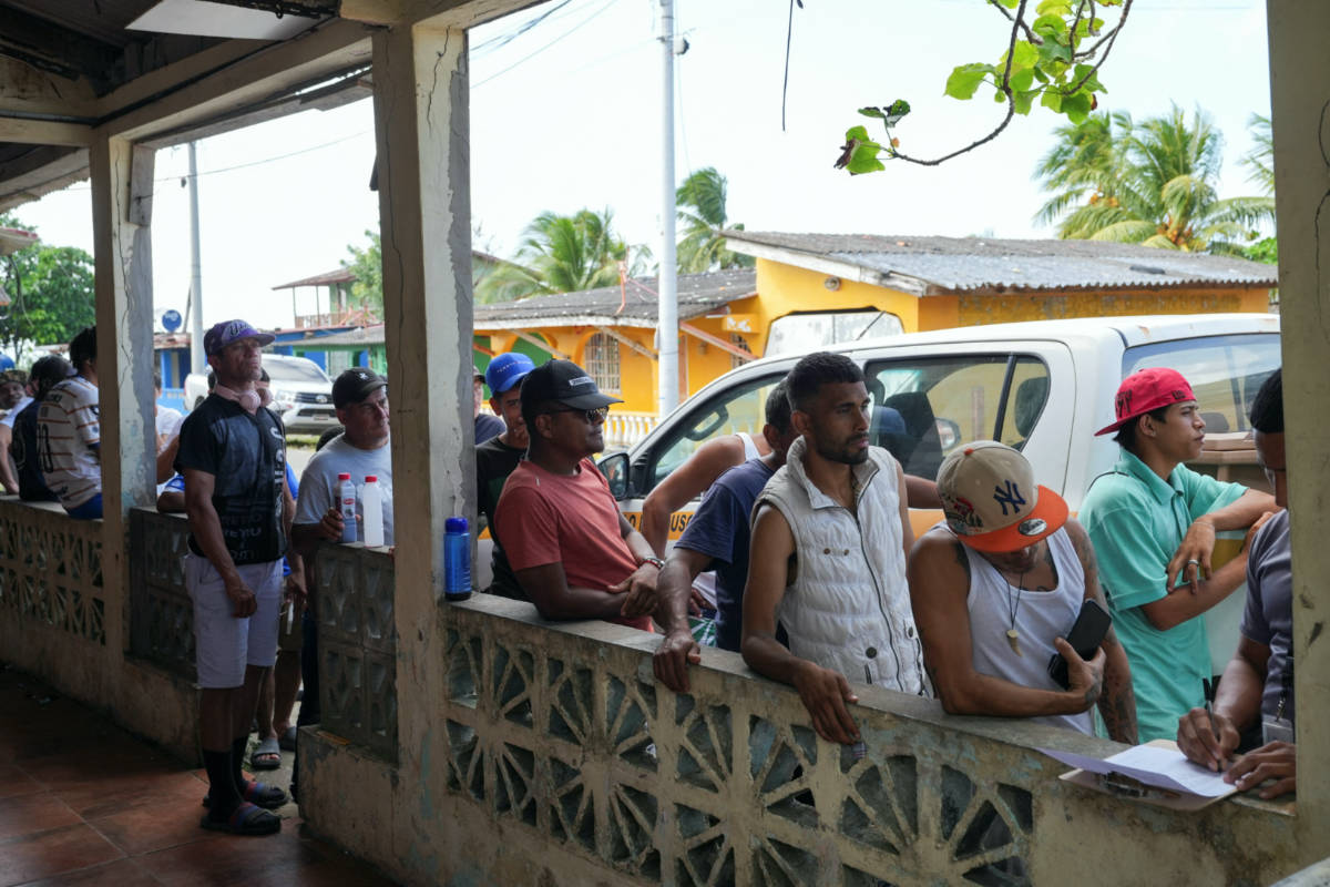 Hopeful yet wary, Venezuelans across Latin America mull going home